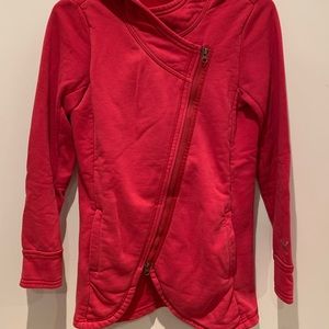 Bright pink Puma sweatshirt with asymmetrical zipper detail. Size M